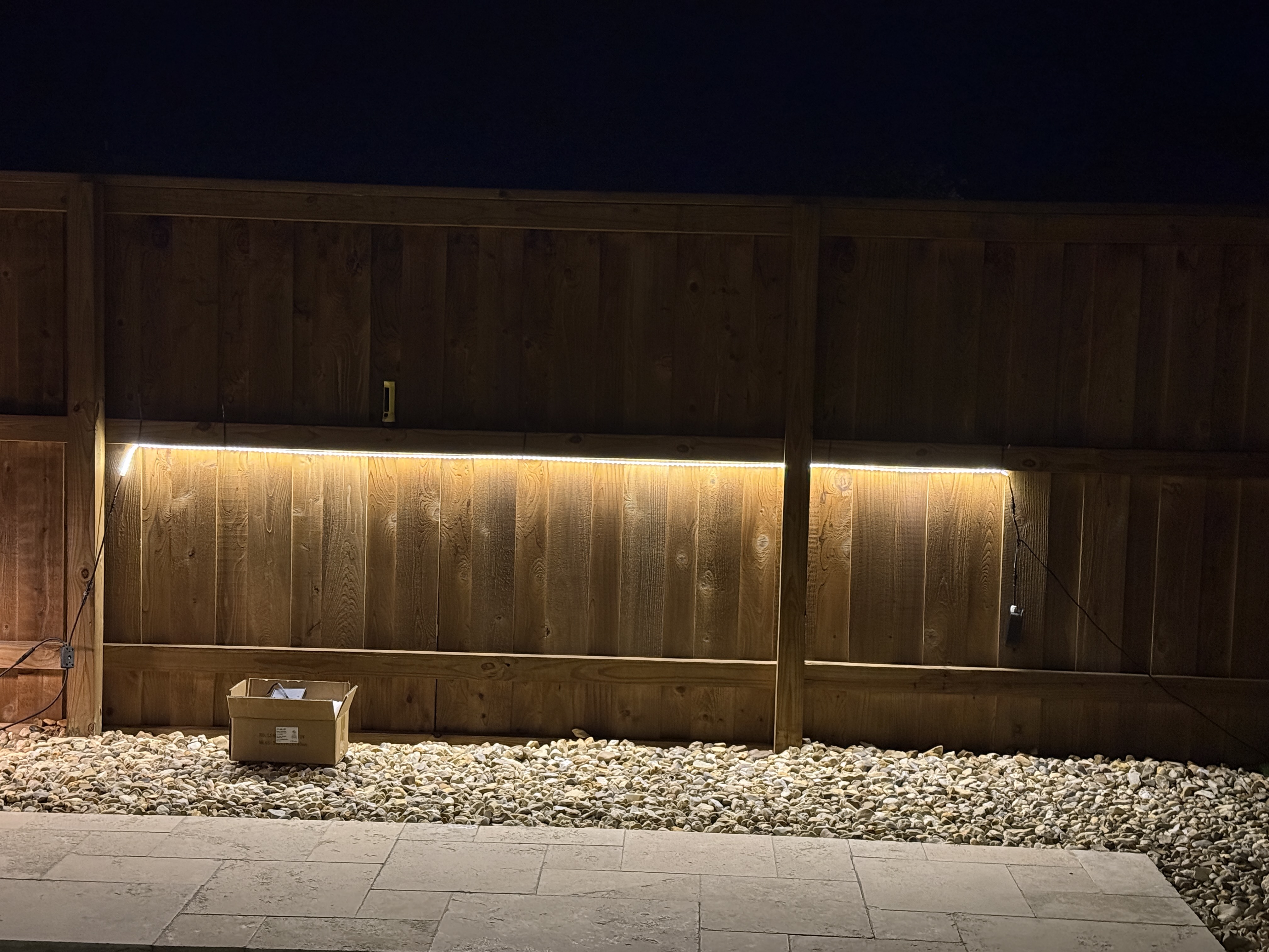 Warm White Fence Wash — permanent exterior lighting in Backyard fence